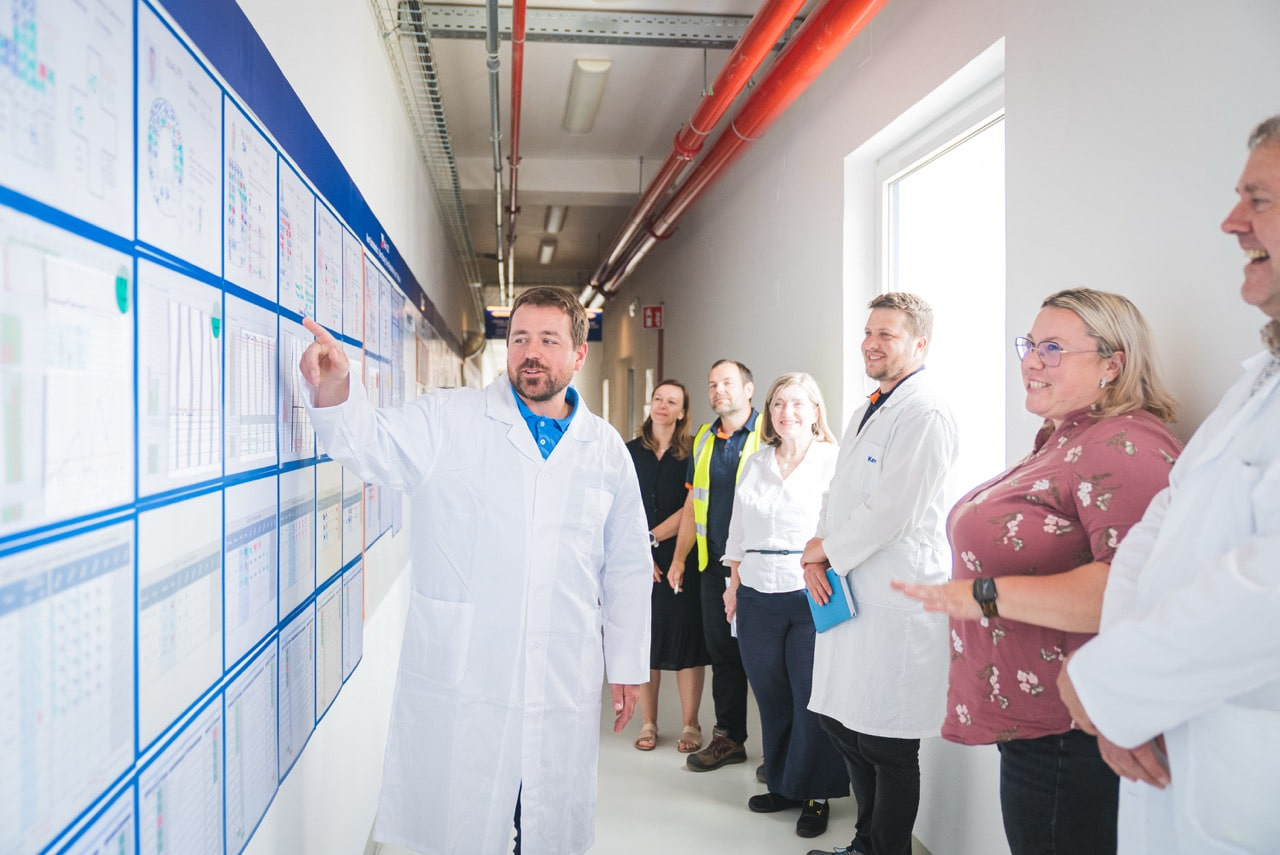 doctor pointing to schedule for employees